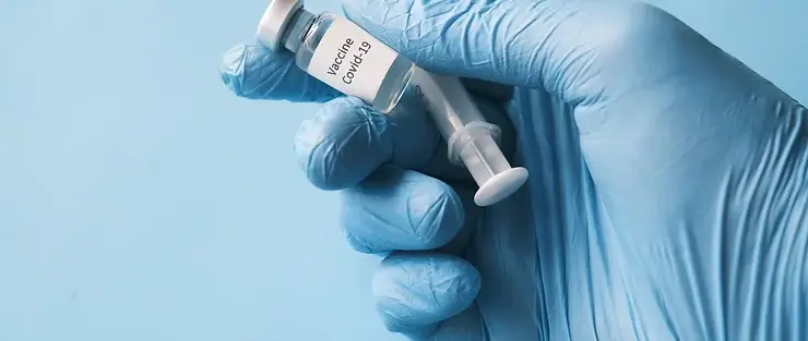 COVID-19 vaccine in hand