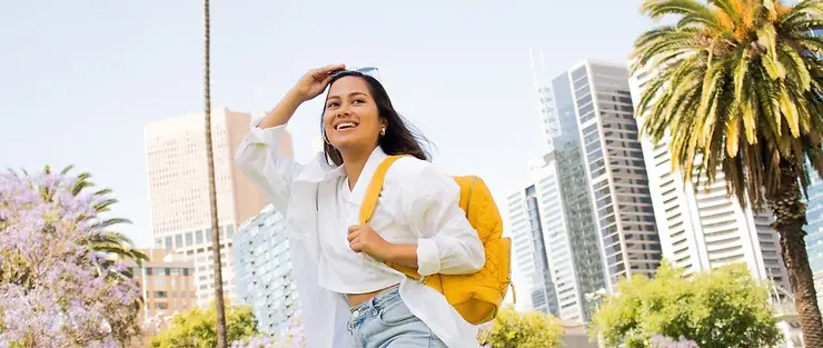 Student with backpack outdoors