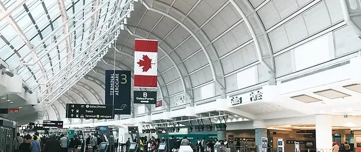 Canadian airport terminal with flag