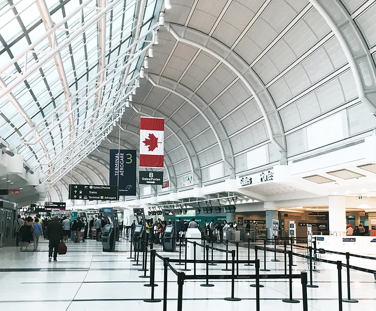 Canadian airport terminal with flag